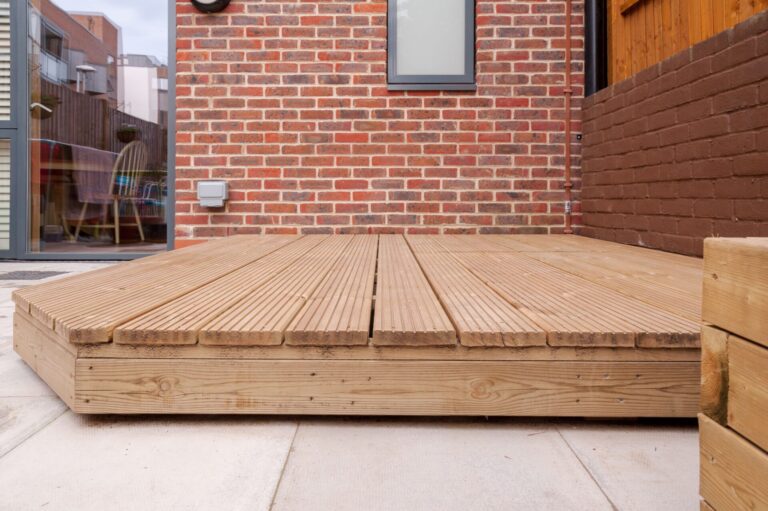Newly built wooden deck in backyard.
